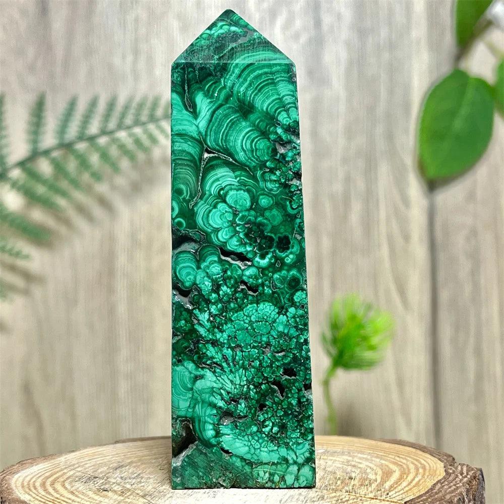 Polished Malachite Crystal Obelisk Tower with deep green banded patterns for heart chakra healing and transformation.
