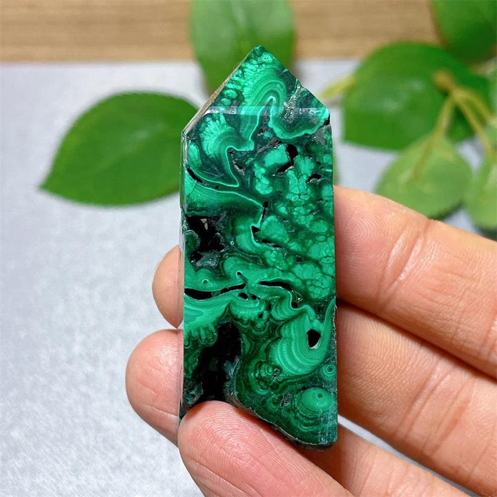 Polished Malachite Crystal Tower featuring vibrant green banded patterns for healing, growth, and transformation.