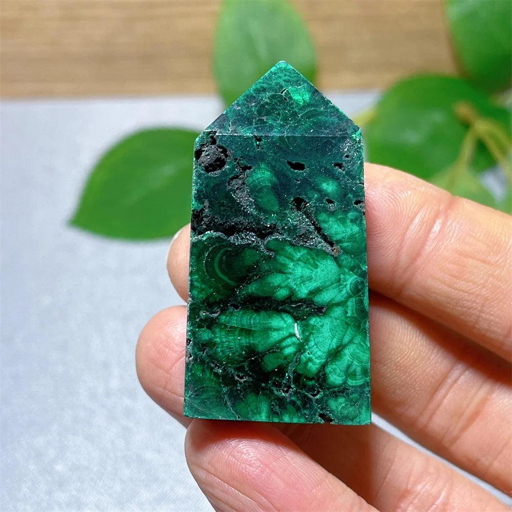 Polished Malachite Crystal Tower featuring deep green banded patterns for transformation and heart chakra healing.