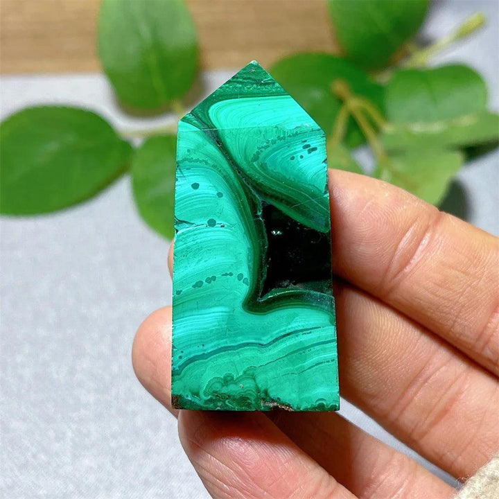 Polished Malachite Crystal Tower featuring vibrant green banded patterns for deep healing and growth energy.