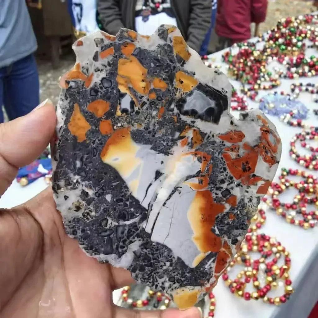 Maligano Jasper Crystal Slab with bold yellow, deep black, and creamy white swirls, offering grounding and mental clarity.