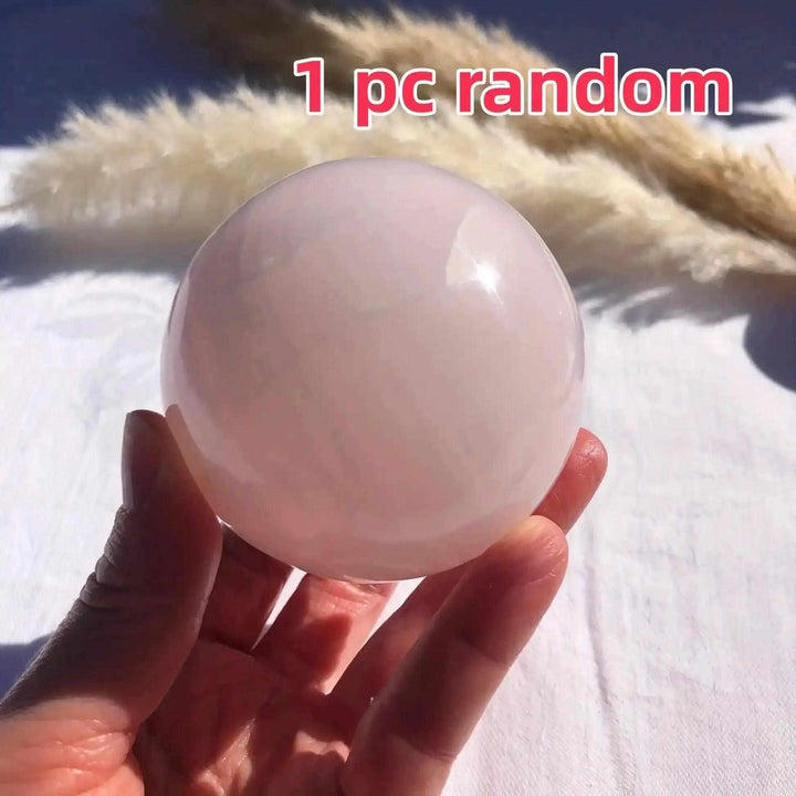 Hand-polished Mangano Calcite sphere featuring soft pastel pink tones for Heart chakra healing and emotional ease.