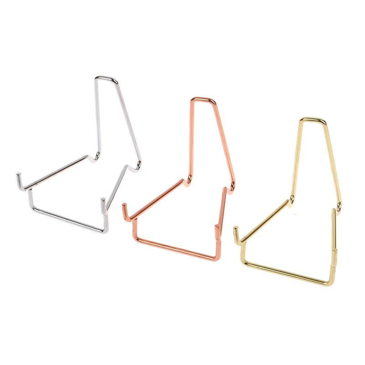 Elegant metal arm crystal display easels in silver, rose gold, and gold finishes, ideal for showcasing crystals.