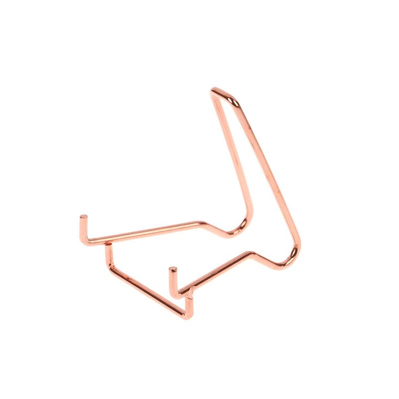 Rose gold metal arm easel stand, ideal for displaying crystals, minerals, geodes, or fossils.