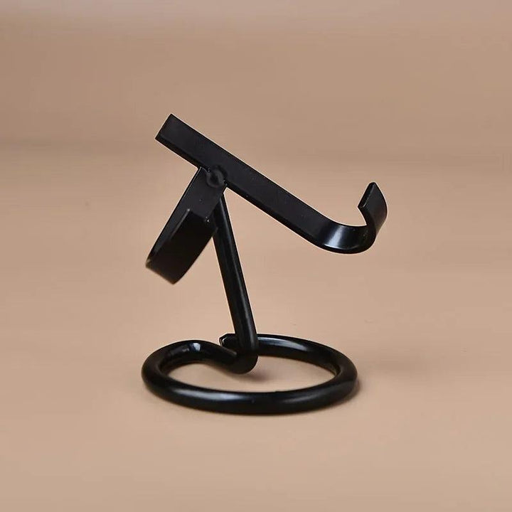 Black metal display stand with a round base and angled cradle for crystals.