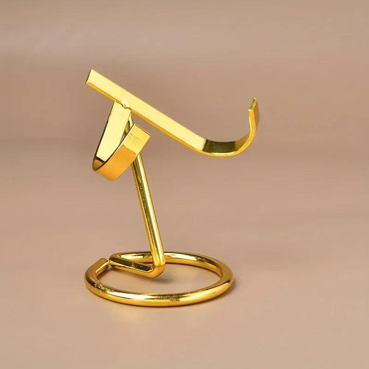 Gold metal display stand for crystals, featuring a sleek, modern design with a weighted base.