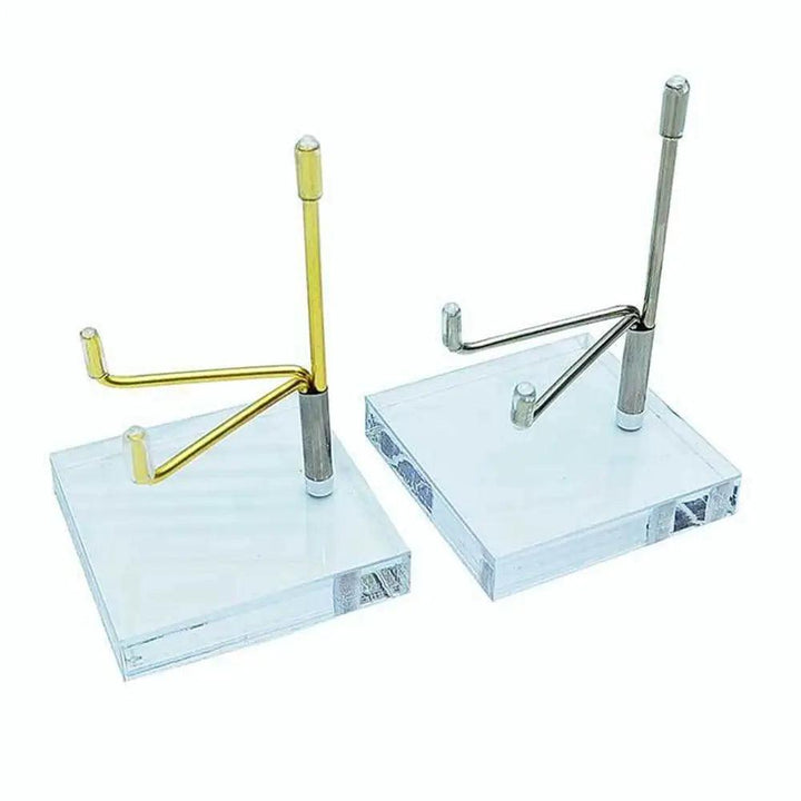 Gold and silver metal crystal ball display stands with clear acrylic bases for spheres.