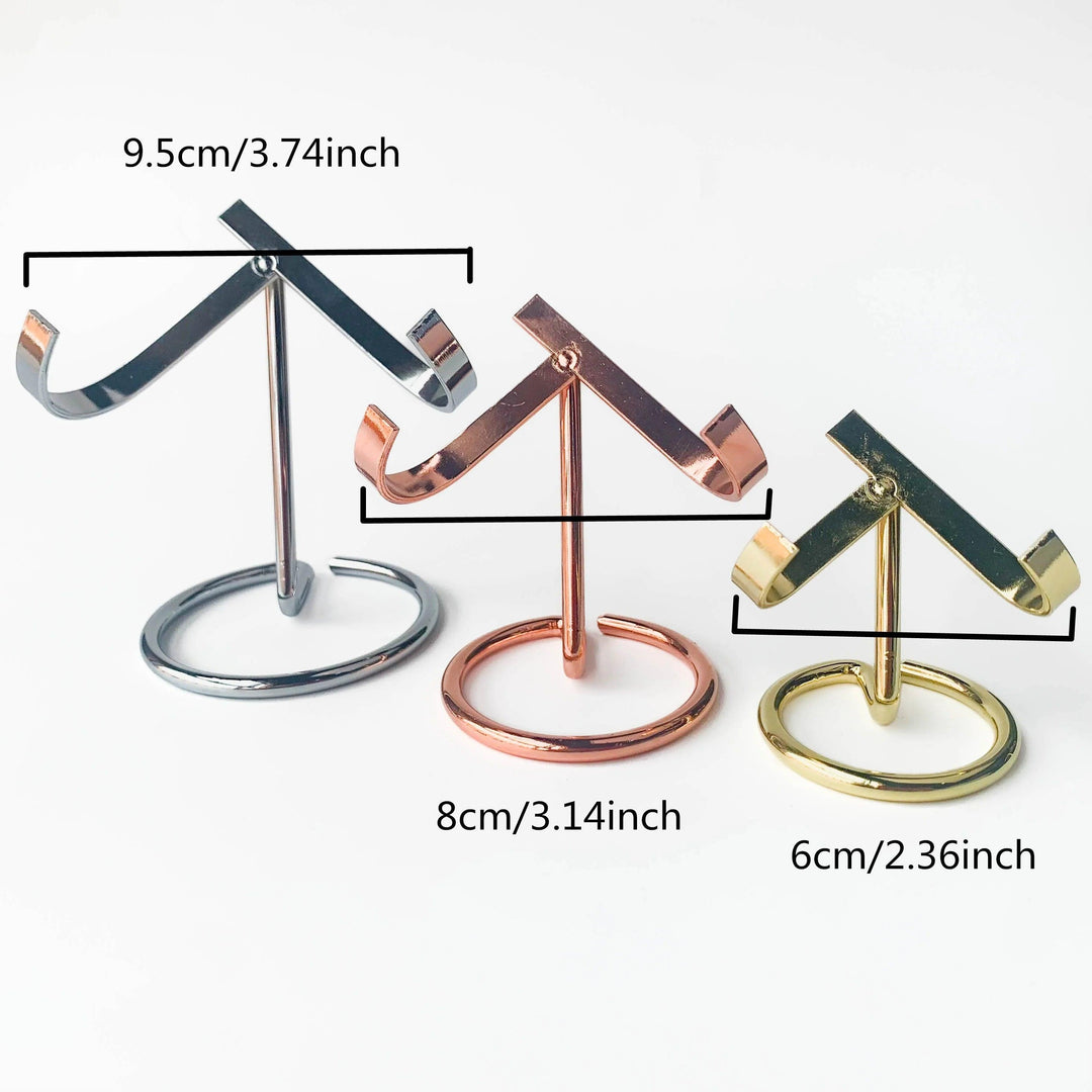 Three metal heart crystal sphere display stands in silver, rose gold, and golden finishes, showing three sizes.