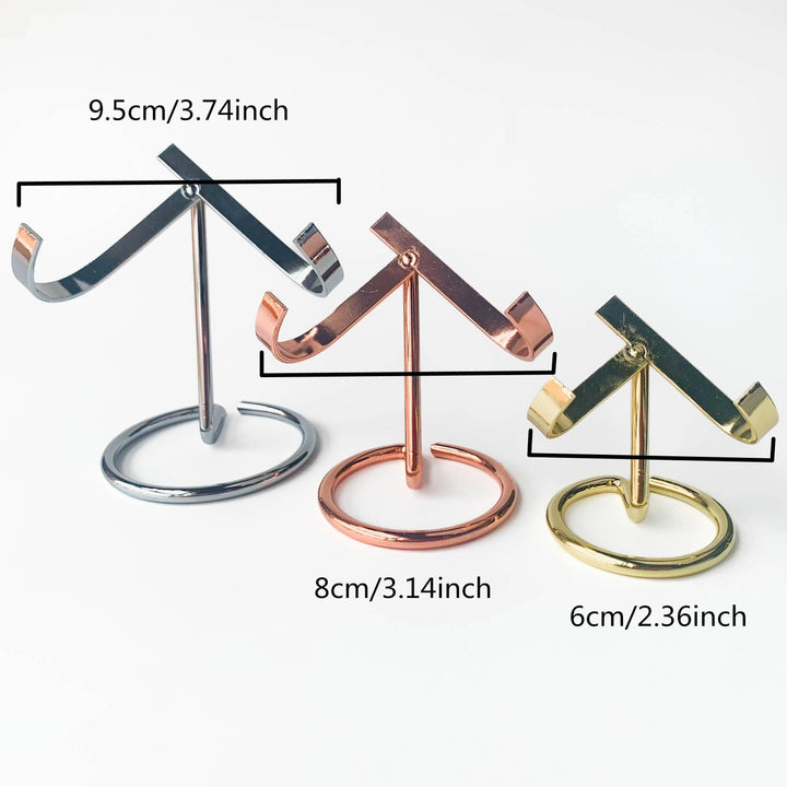 Three metal heart crystal sphere display stands in silver, rose gold, and golden finishes, showing three sizes.