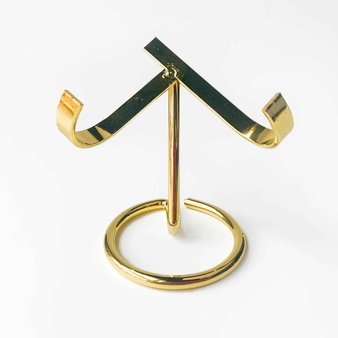 Golden metal heart-shaped crystal sphere display stand, elegant and practical for altars or desks.