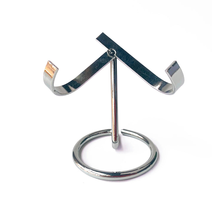 Silver metal heart crystal sphere display stand, elegant and practical for altars or desks.