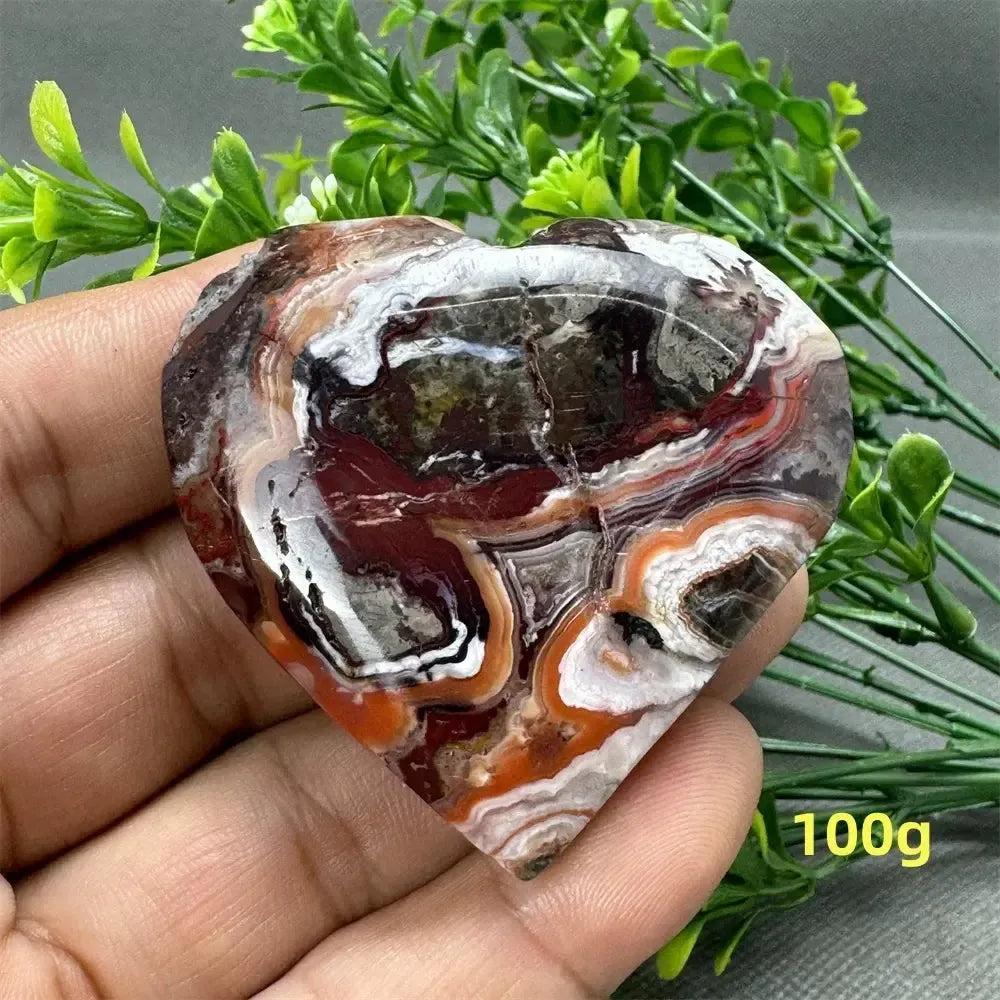 Mesmerizing Mexican Agate crystal freeform heart, 100g, with warm oranges, deep reds, and creamy whites.