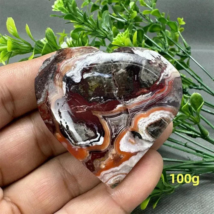 Mesmerizing Mexican Agate crystal freeform heart, 100g, with warm oranges, deep reds, and creamy whites.