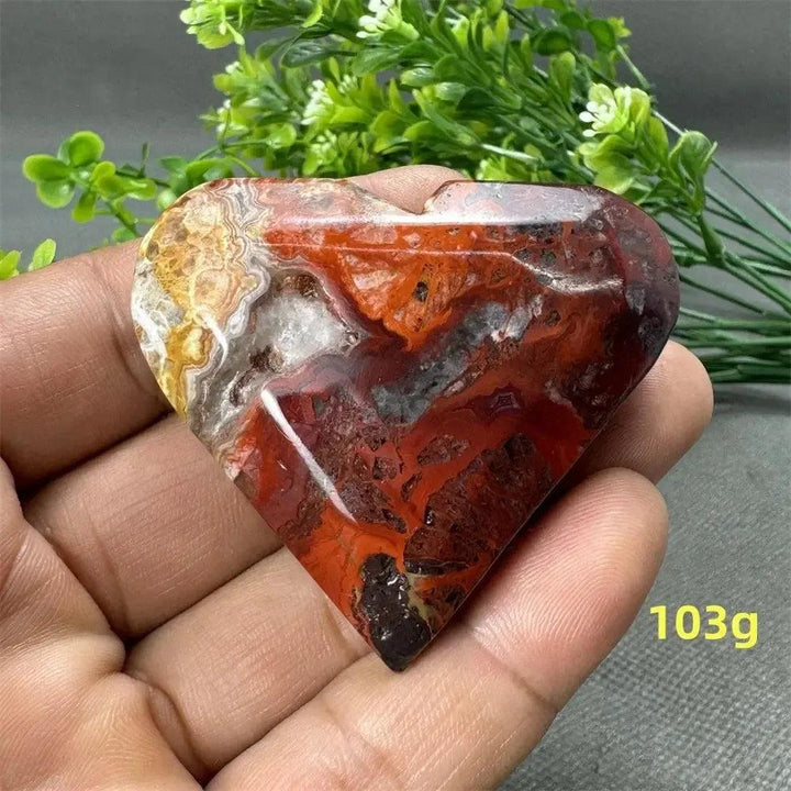 Mesmerizing Mexican Agate heart, 103g, with warm oranges, deep reds, and creamy whites for strength and grounding.