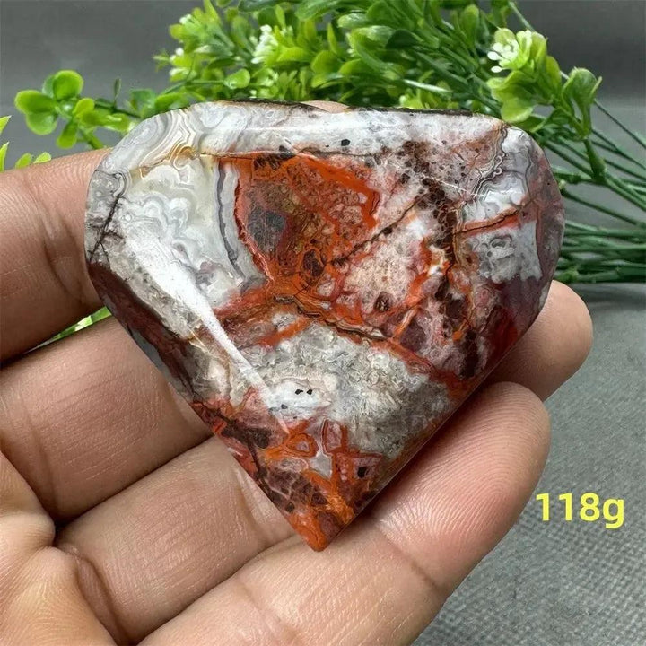Mexican Agate Crystal Freeform: Polished heart-shaped stone with warm oranges, reds, whites, and browns. 118g.