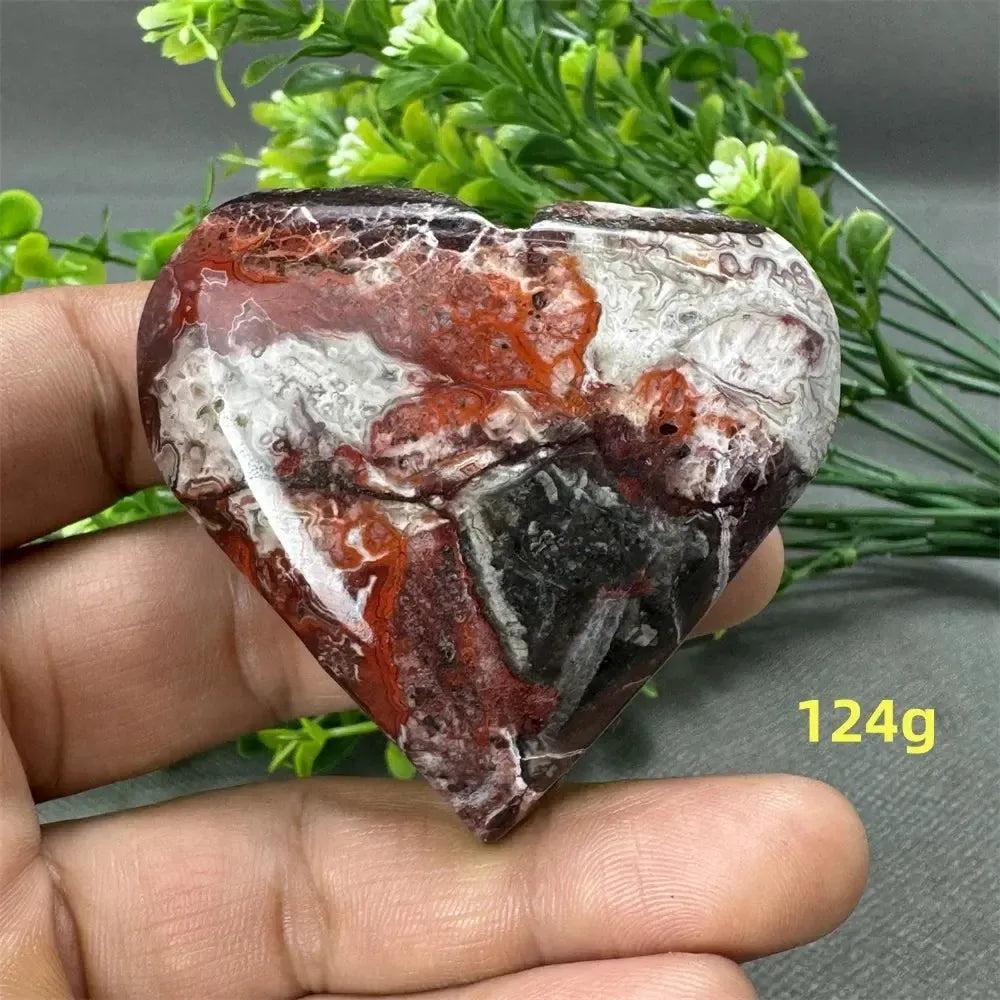 Mesmerizing Mexican Agate heart, 124g, with warm oranges, deep reds, creamy whites, and earthy browns.