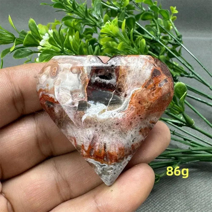 Mexican Agate Crystal Freeform heart, 86g, showcasing warm oranges, deep reds, and creamy whites for strength and grounding.