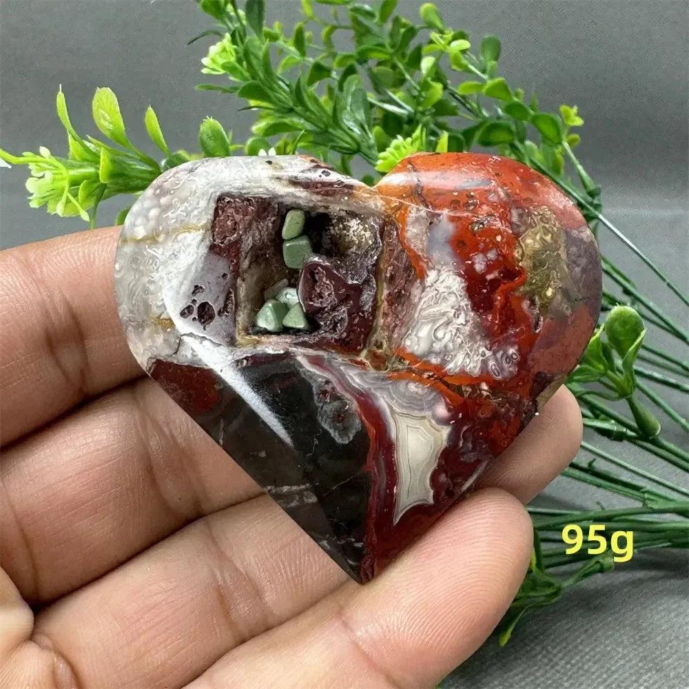 Mexican Agate Crystal Freeform, a 95g heart-shaped stone with warm oranges, deep reds, and creamy whites.