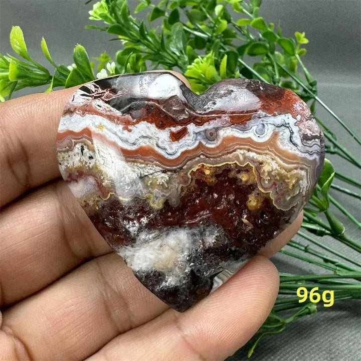 Mexican Agate heart crystal, 96g, with warm oranges, deep reds, and creamy whites, for strength and grounding.