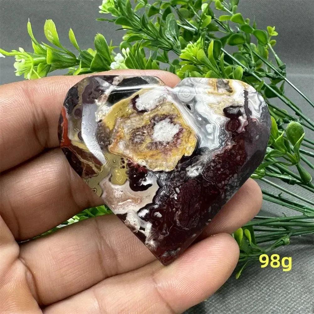 Mexican Agate Crystal Freeform: Heart-shaped, 98g, with warm oranges, deep reds, creamy whites, and earthy browns.