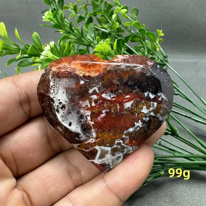 Mexican Agate Crystal Freeform: Heart-shaped, polished stone with warm oranges, deep reds, and earthy browns. 99g.