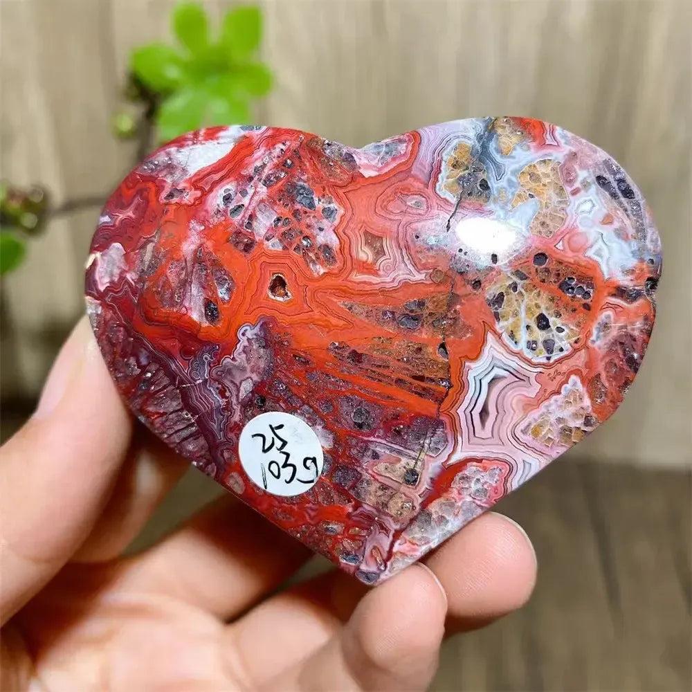 Mexican Agate Crystal Heart for Joy & Emotional Balance, featuring vibrant red, white, and orange banded patterns.