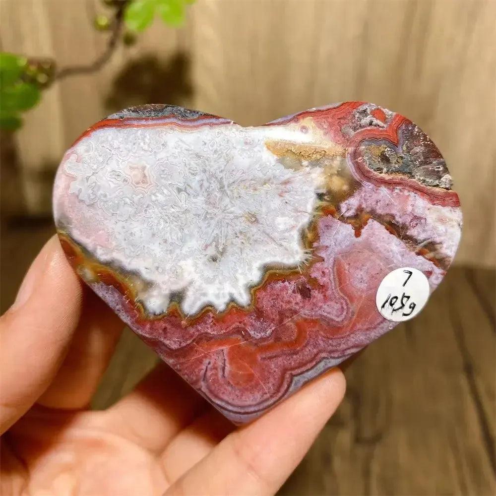 Vibrant Mexican Agate crystal heart with rainbow bands for joy & emotional balance.