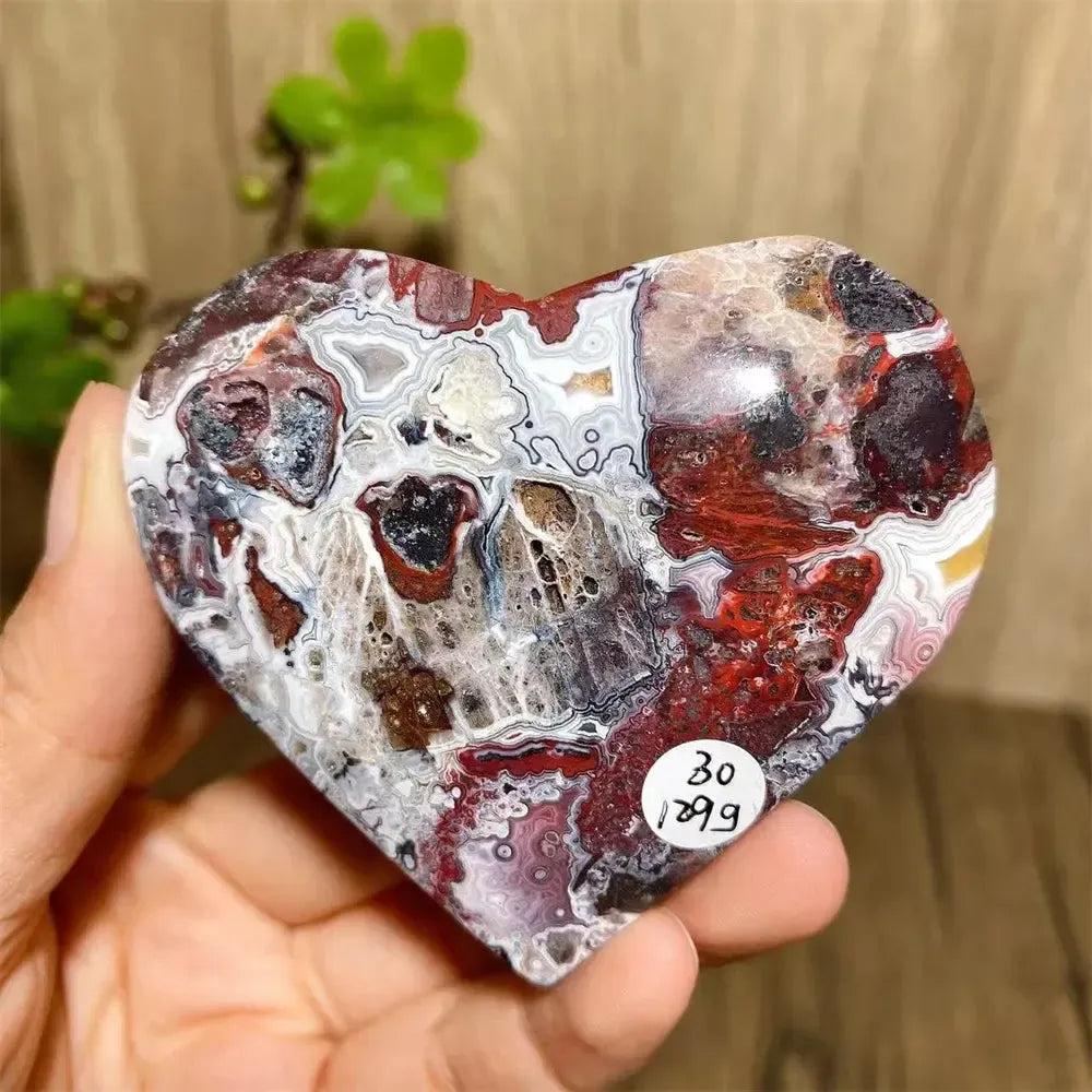 Vibrant Mexican Agate crystal heart for joy & emotional balance, featuring red, white, and purple banding.