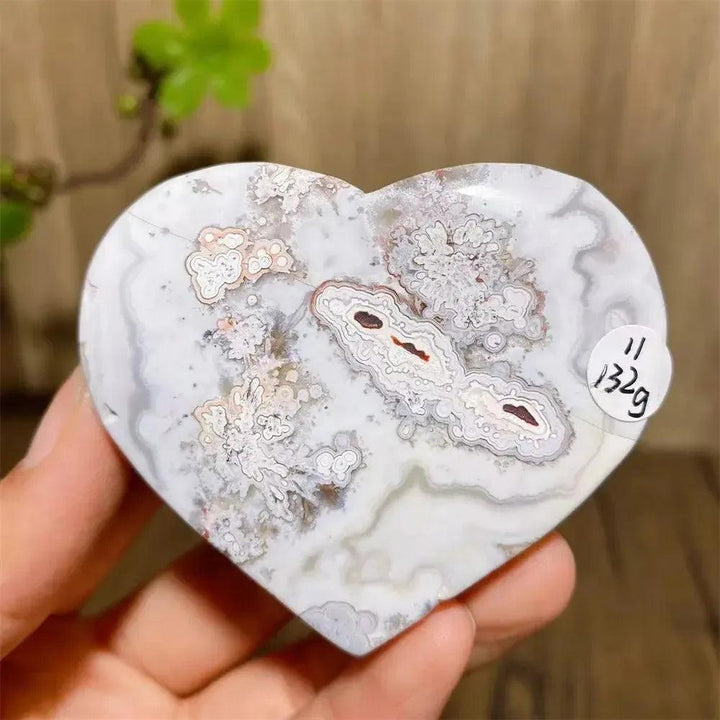 Mexican Agate Crystal Heart for Joy & Emotional Balance. White, pink, and gray banded agate heart with druzy center.