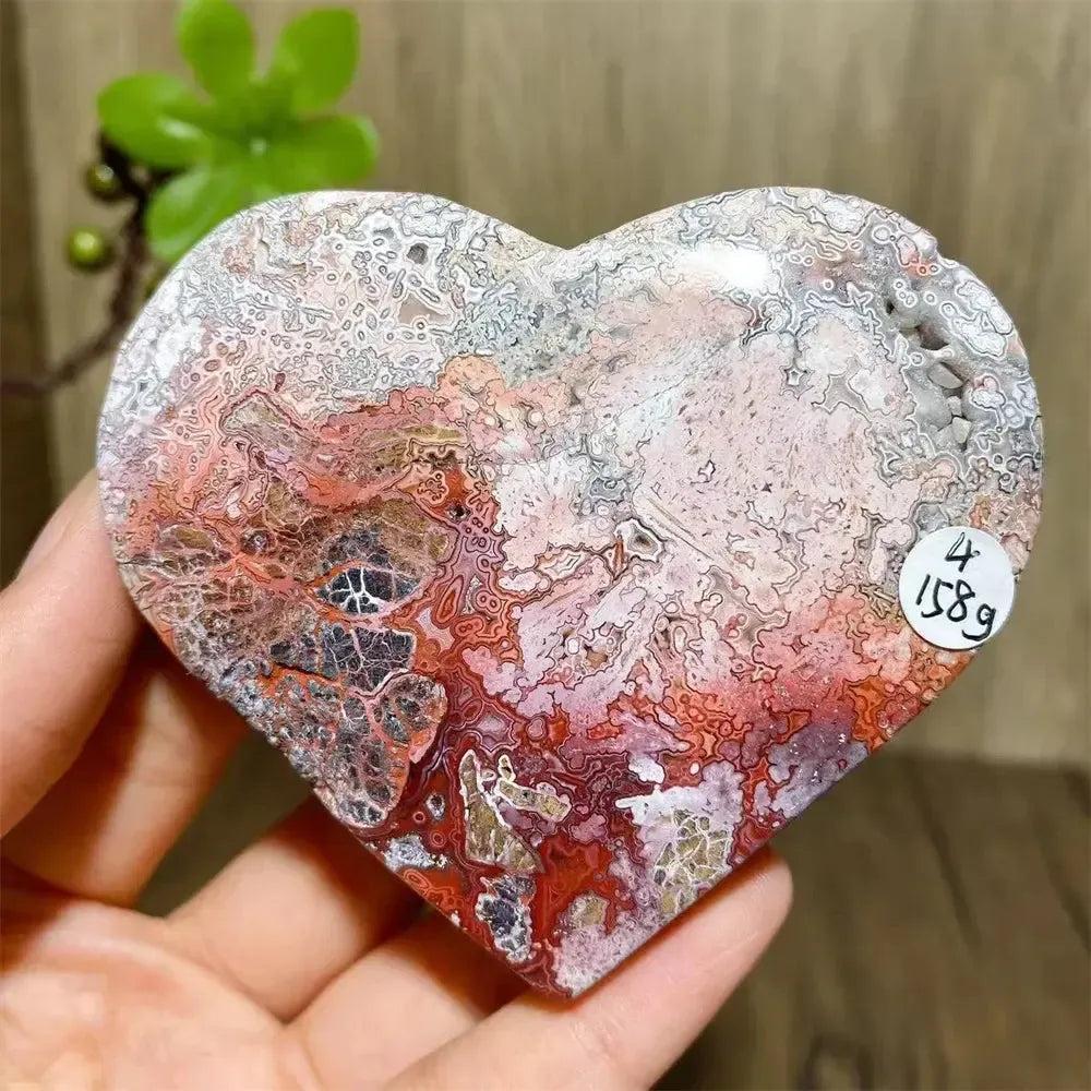 Mexican Agate Crystal Heart: Vibrant pink, purple, orange, red banded geode for joy & emotional balance.