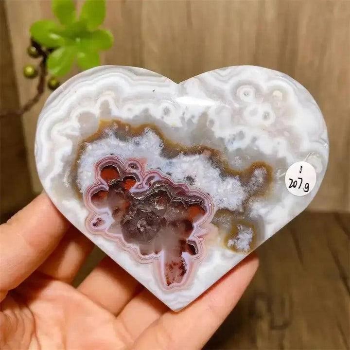 Mexican Agate Crystal Heart: Polished white, red, and brown banded geode with sparkling druzy interior for joy.
