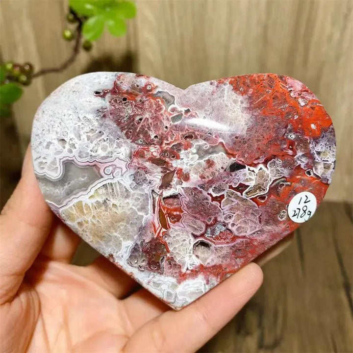 Mexican Agate Crystal Heart for Joy & Emotional Balance, with vivid rainbow bands and sparkling druzy interior.
