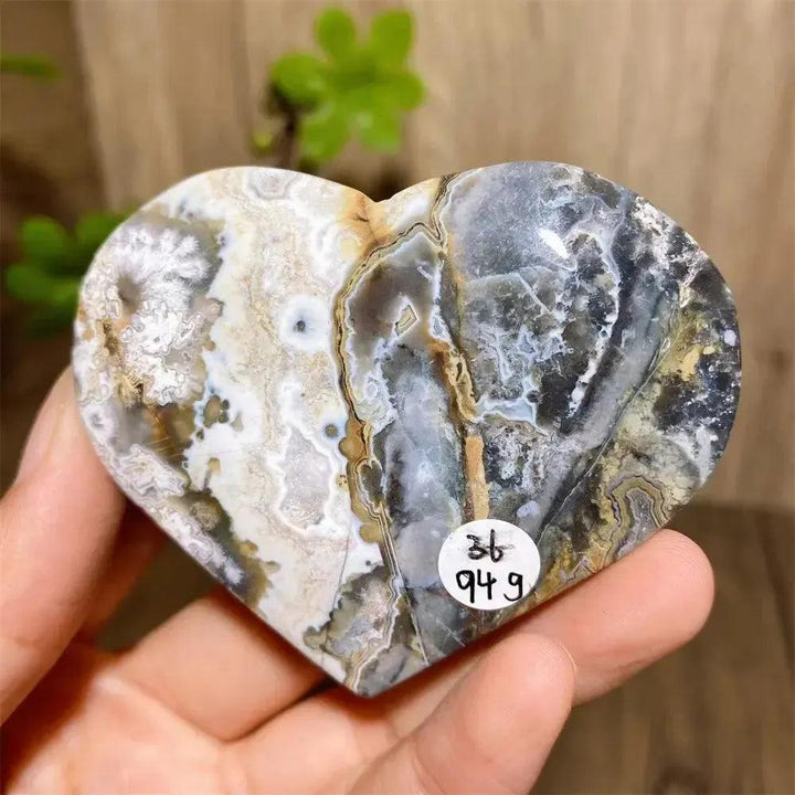 Mexican Agate Crystal Heart for Joy & Emotional Balance, with vivid rainbow bands and sparkling druzy interior.