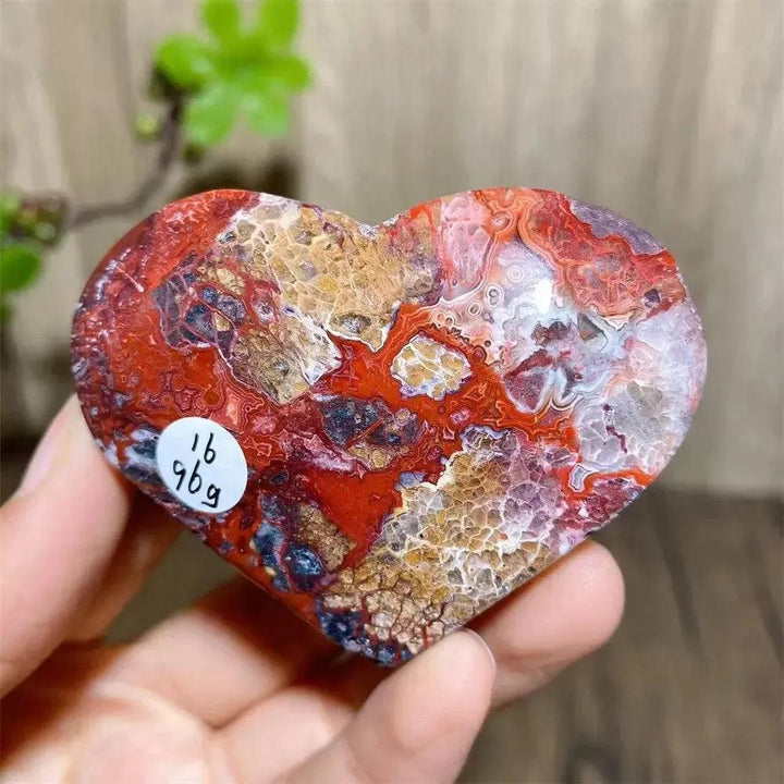 Vibrant Mexican Agate crystal heart for joy & emotional balance, showcasing vivid rainbow bands and sparkling druzy.