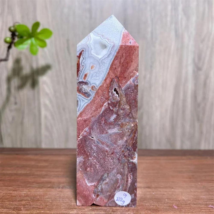 Mexican Agate Crystal Tower with bold swirling bands of deep red, cream, and rust, offering grounding & stability.