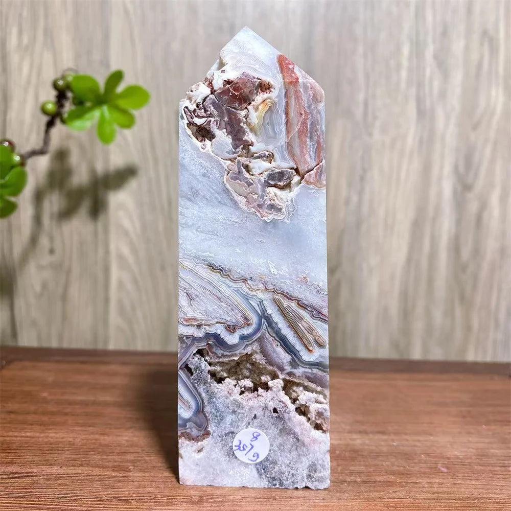 Mexican Agate Crystal Tower: Bold red, cream, rust, and white swirling bands in a natural geode specimen. Grounding & Stability.