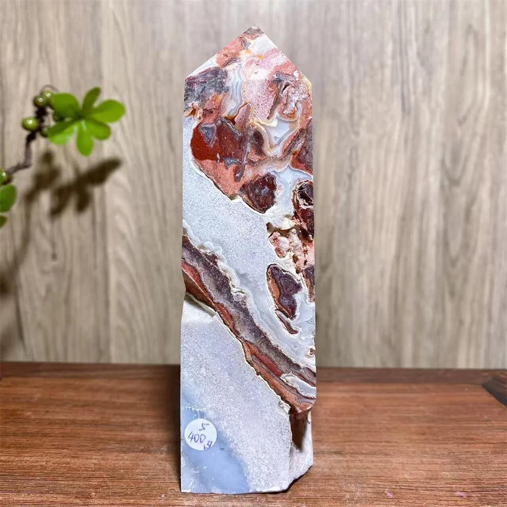 Mexican Agate Crystal Tower with bold red, cream, and rust swirling bands. Natural geode for grounding & stability.