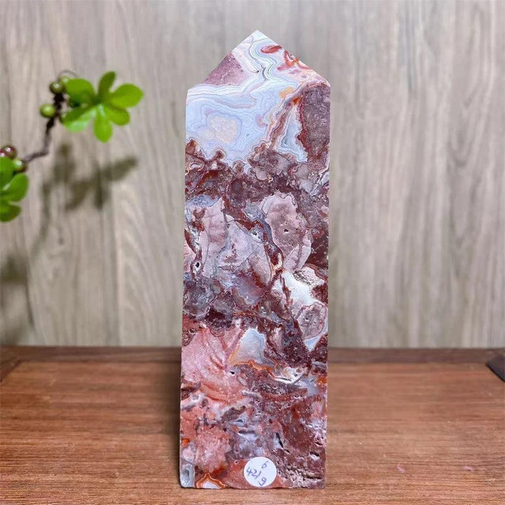 Mexican Agate Crystal Tower with bold swirling bands of deep red, cream, and rust, a grounding raw geode specimen.