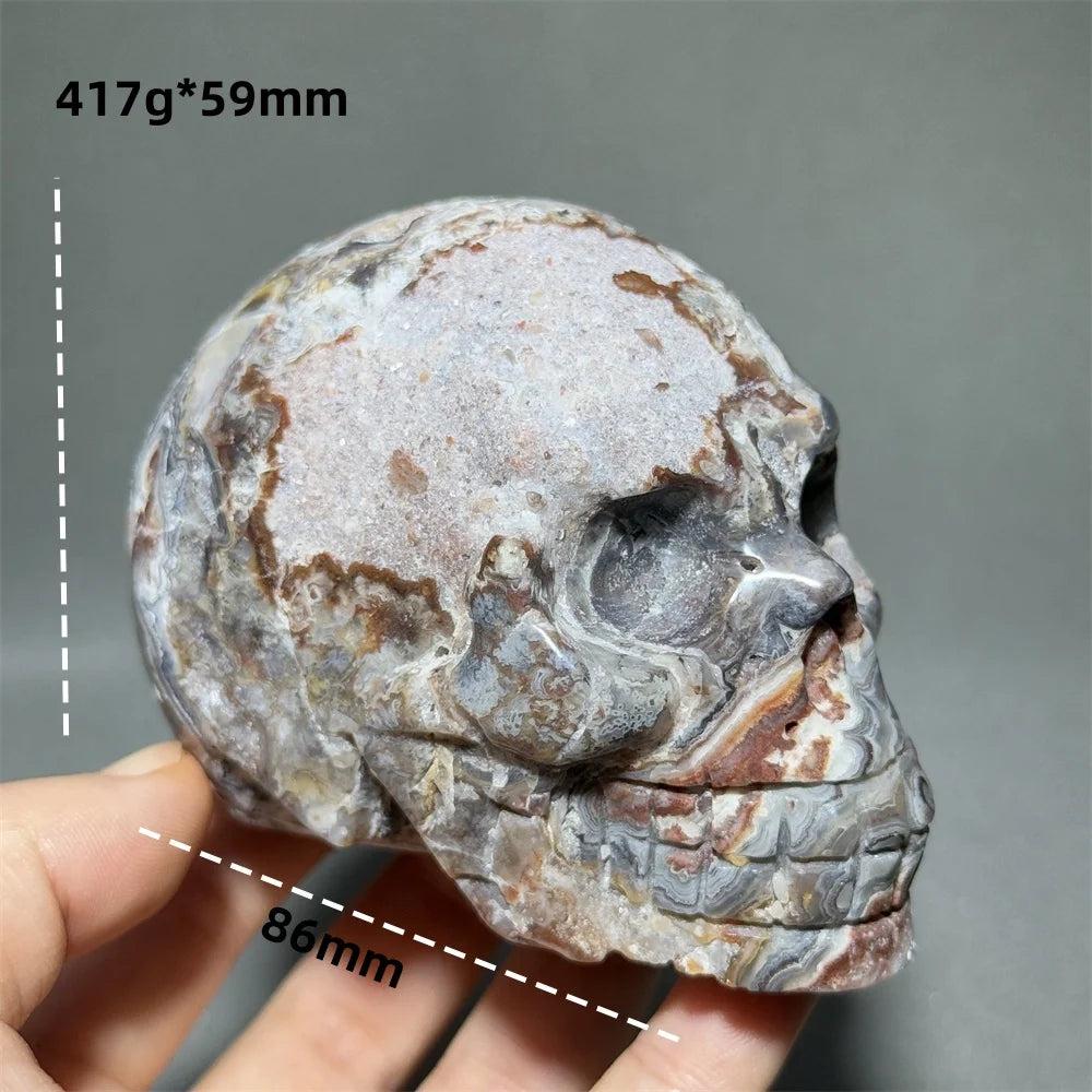 Hand-carved Mexican Agate skull, 86mm, with natural brown, white, and grey patterns for healing energy.