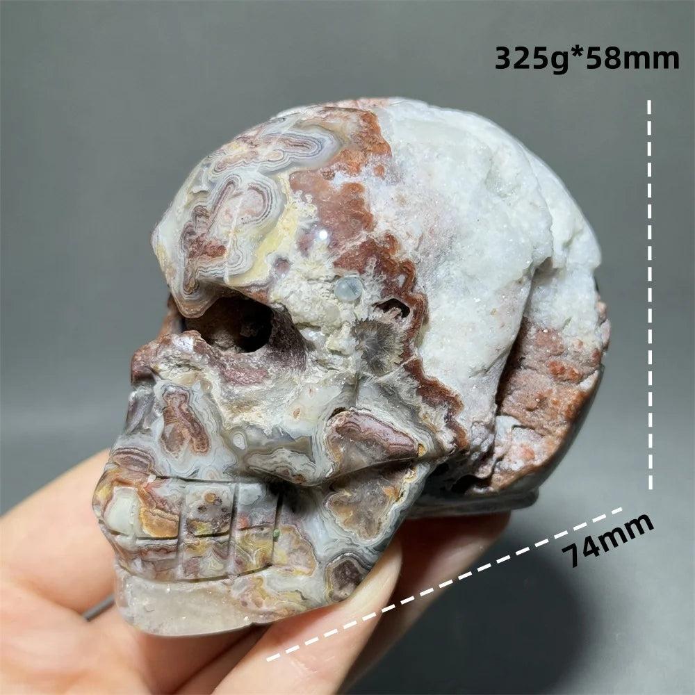 Hand-carved Mexican Agate skull, 74mm, with natural brown, white, and grey patterns for healing and feng shui.