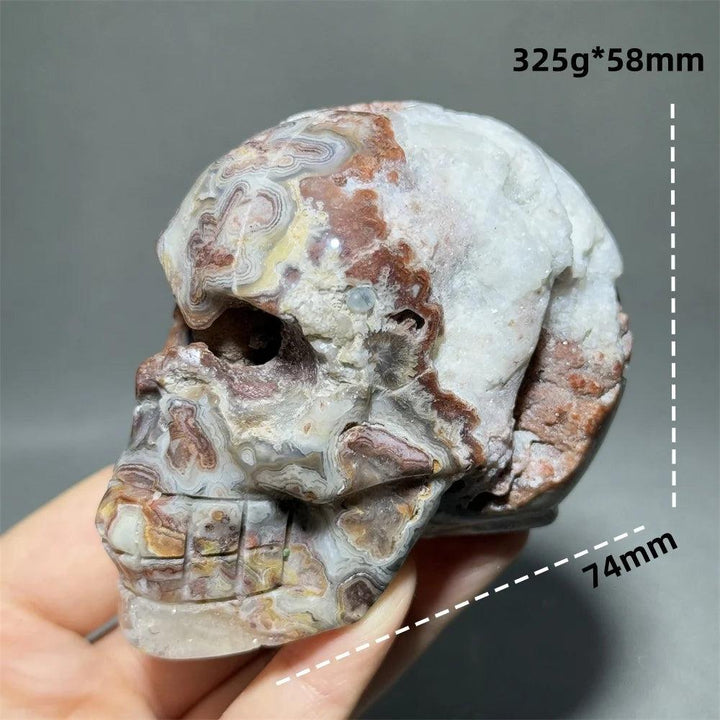 Hand-carved Mexican Agate skull, 74mm, with natural brown, white, and grey patterns for healing and feng shui.