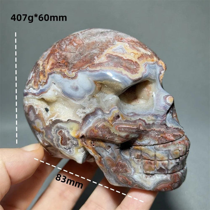 Hand-carved Mexican Agate skull, 83mm, with swirling earthy tones for healing energy and meditation.