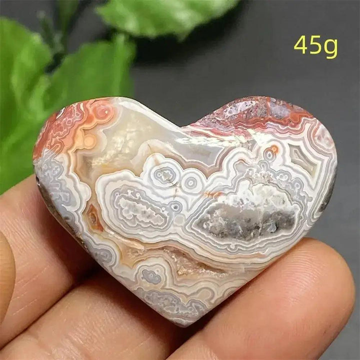 Mexican Striped Agate Crystal Heart, a hand-polished, banded stone with warm earthy tones, grounding and nurturing strength.