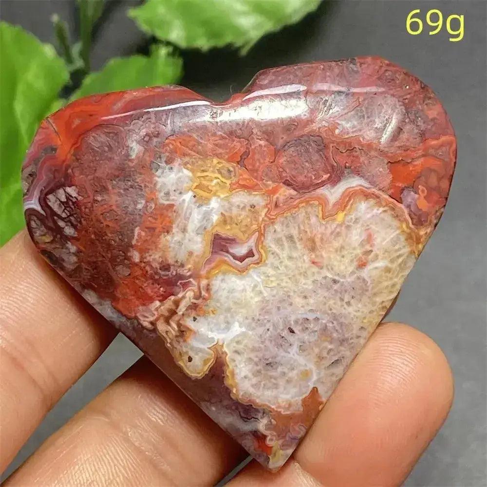 Mexican Striped Agate Crystal Heart, a polished red, orange, and white banded chalcedony for grounding and love.