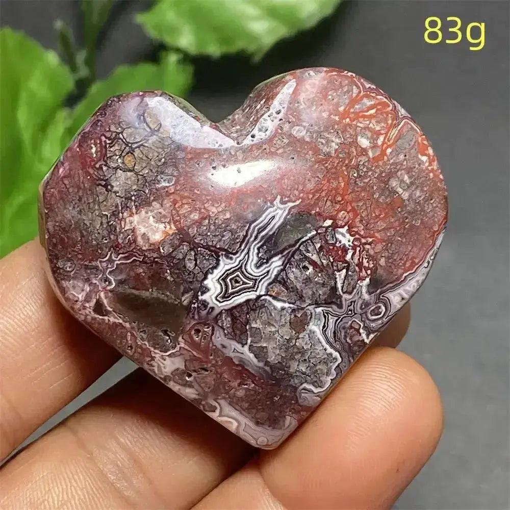 Mexican Striped Agate crystal heart, 83g, with warm earthy tones, parallel banding, and grounding energy.