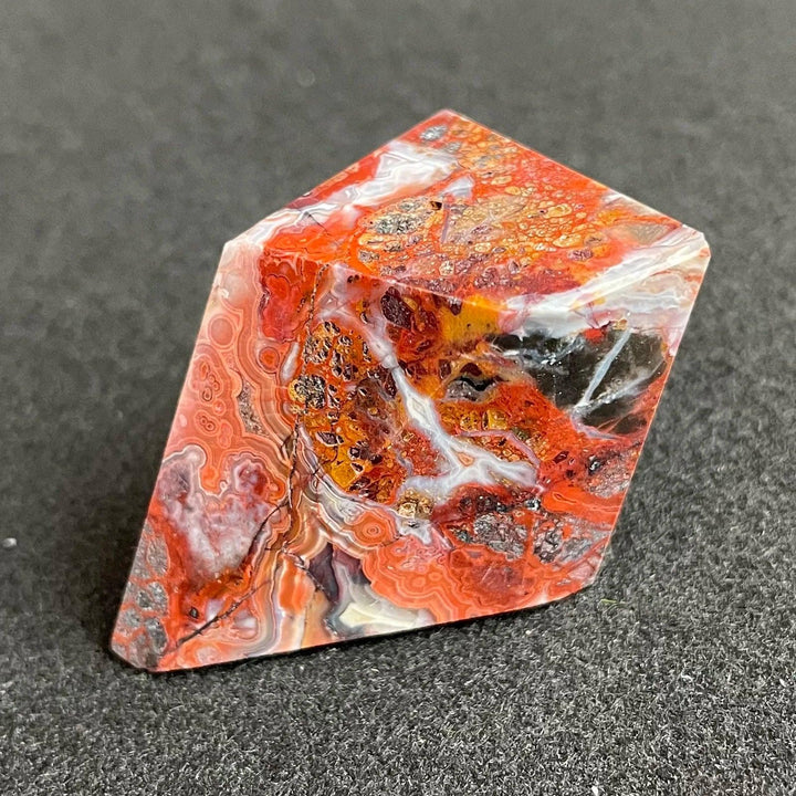 Polished Mexico Agate freeform crystal with vibrant red, orange, and white patterns for reiki healing and home decor.
