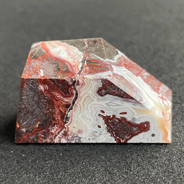 Polished Mexico Agate freeform crystal with striking red and white banded patterns, perfect for Reiki healing and decor.