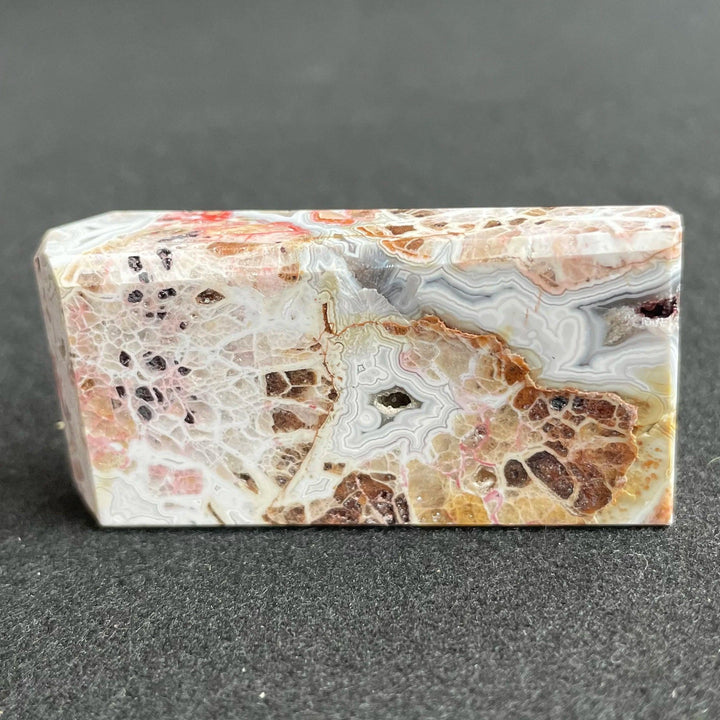 Polished Mexico Agate freeform crystal with intricate banded patterns, earthy tones, and healing energy for home decor.