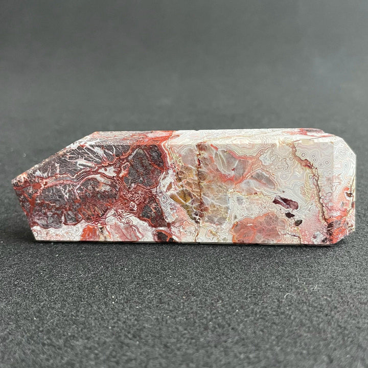 Polished Mexico Agate freeform crystal with vibrant red and white patterns, perfect for Reiki healing and home decor.
