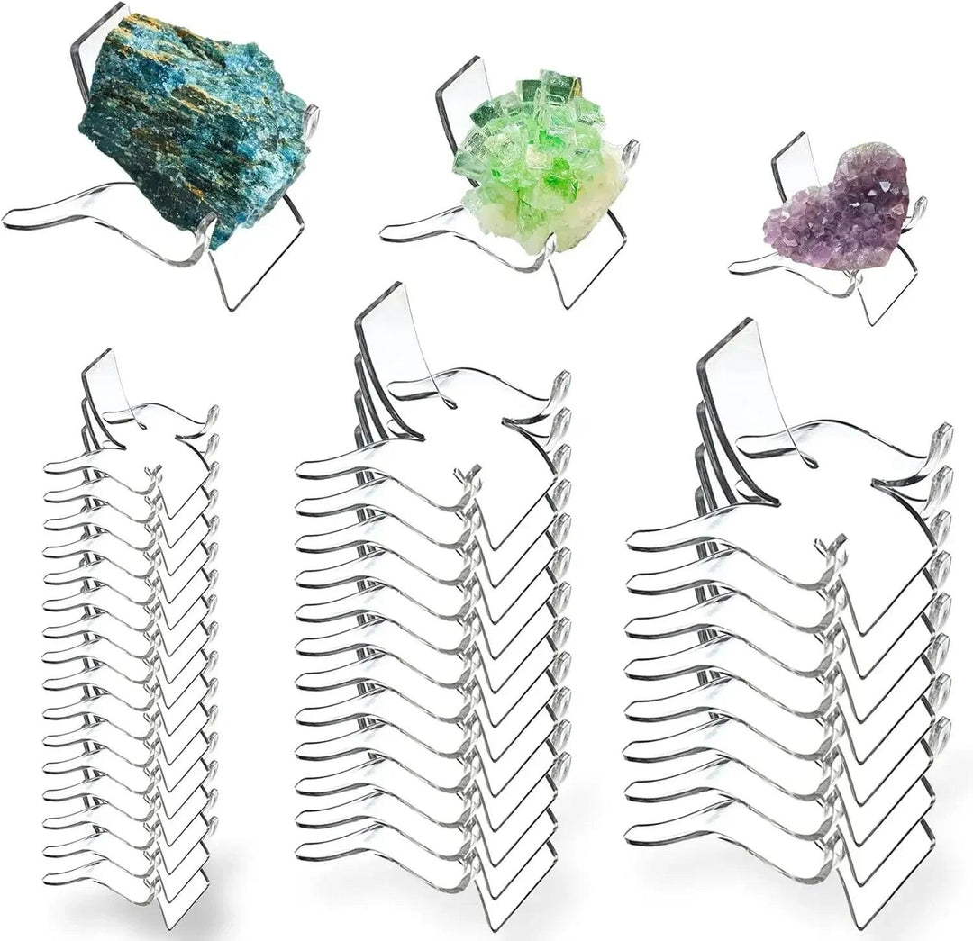Clear acrylic easel stands displaying a blue apatite, green fluorite, and amethyst crystal.